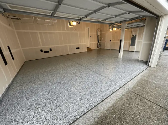 Dove gray flake floor across a multi-bay Seattle-area garage under raised doors