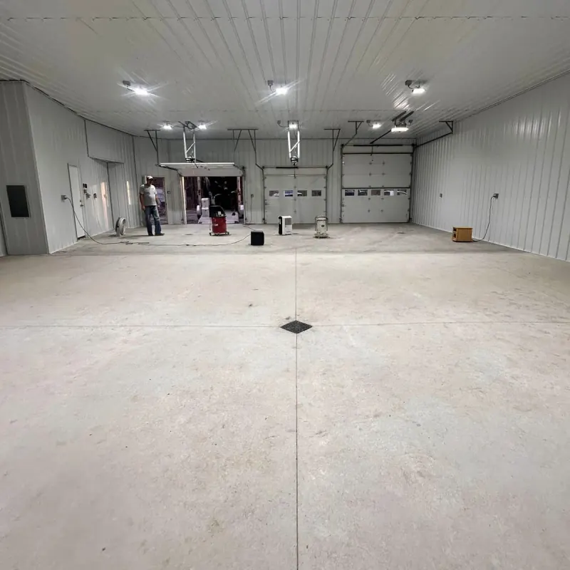 Before: bare concrete in the same shop garage