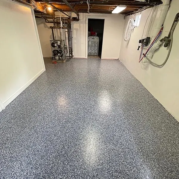 Basement utility room with a black, white and gray flake floor