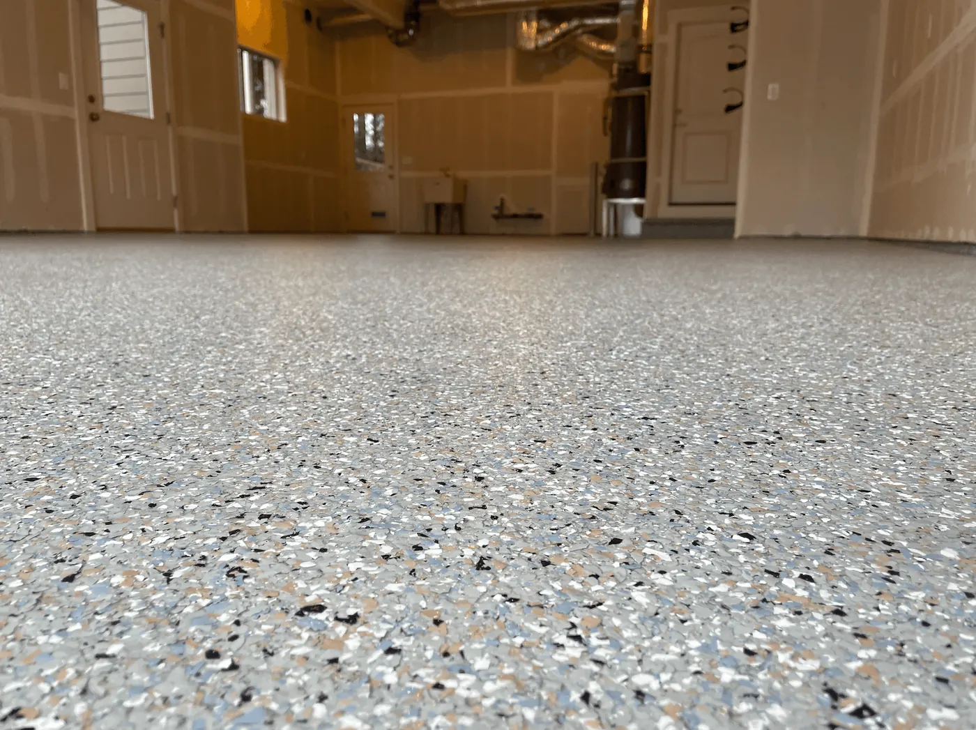 Close-up of an autumn blend flake floor coating