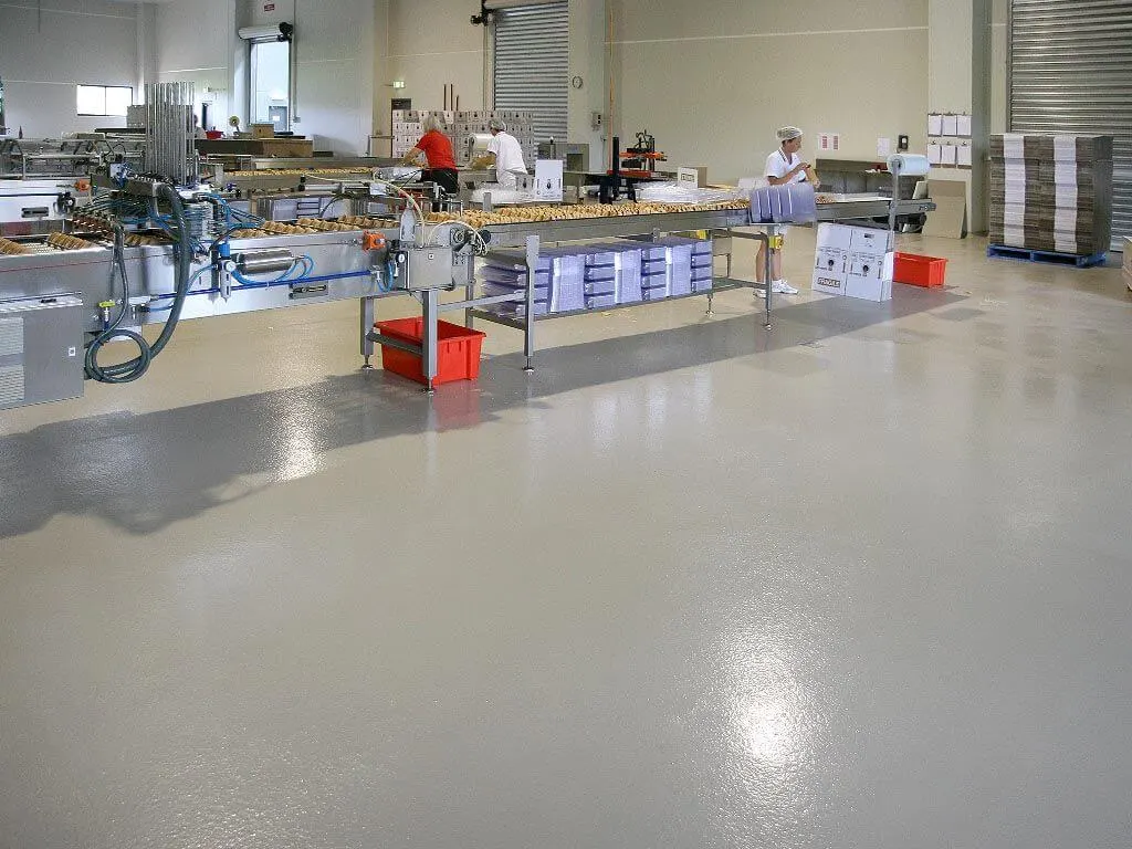 Food production line on a glossy light gray floor