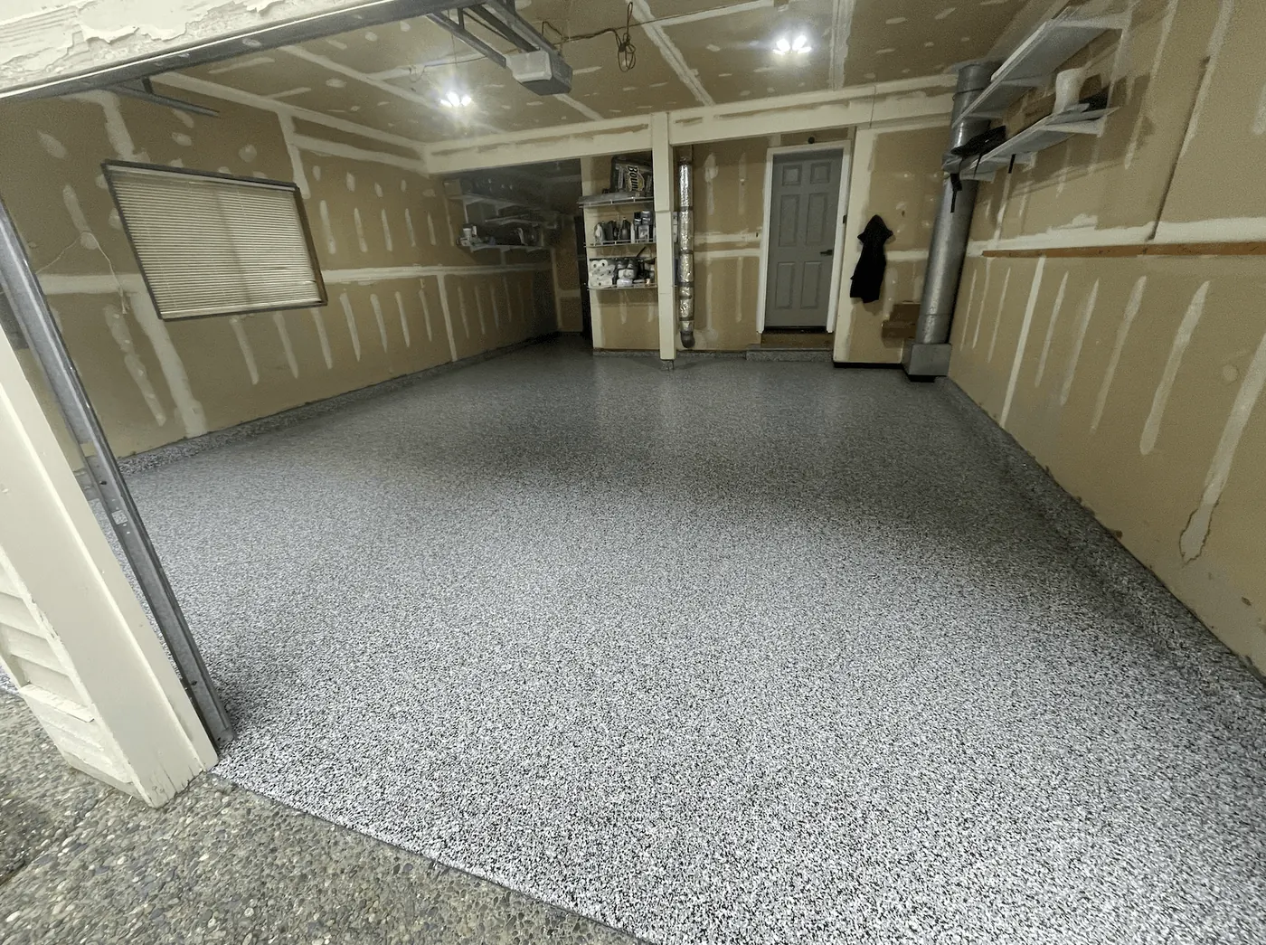 Seattle-area garage with an oyster flake floor coating