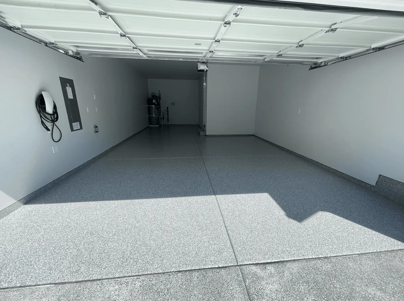 Platinum flake floor in a Seattle-area garage with a wall-mounted EV charger