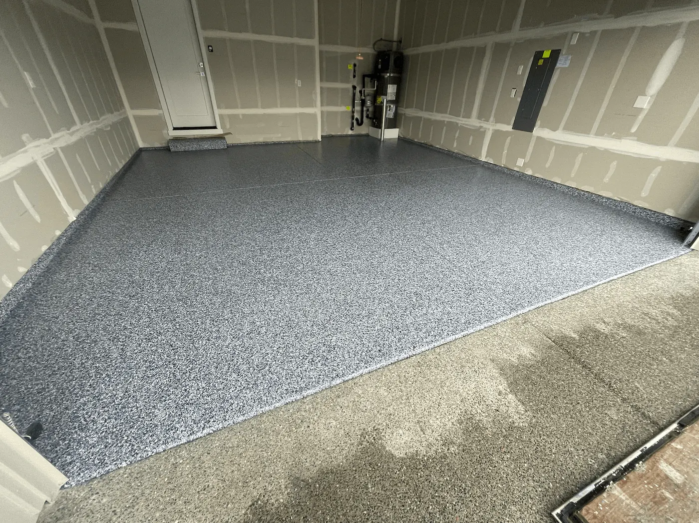 Seattle-area garage with a slate blue flake floor coating