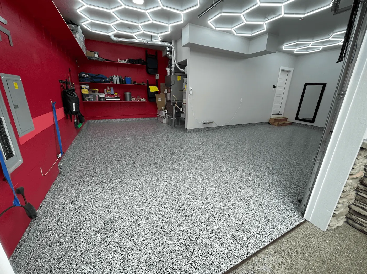 Storm gray flake floor under hexagon LED ceiling lights in a Seattle-area garage