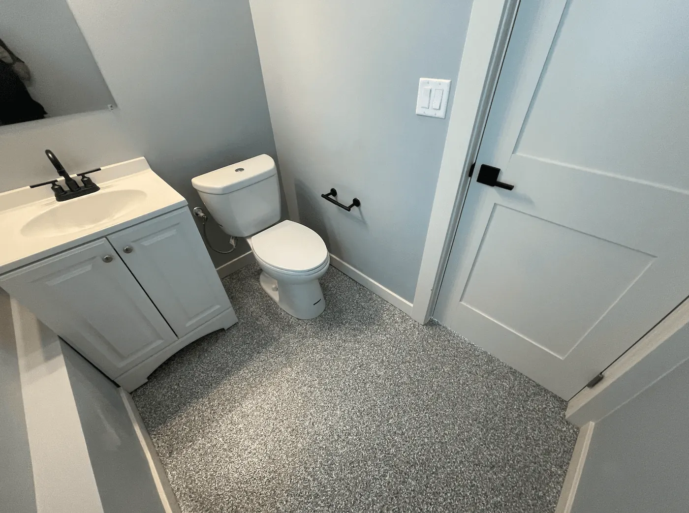Seattle-area bathroom with a gray flake floor coating