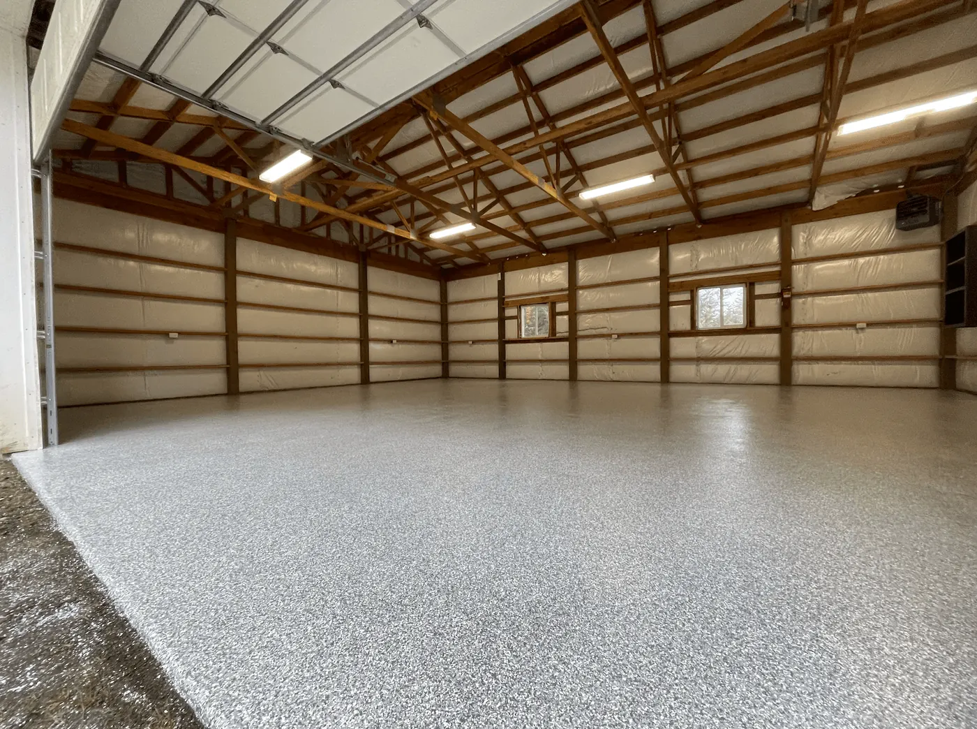 Seattle-area pole barn shop with a pearl flake floor coating