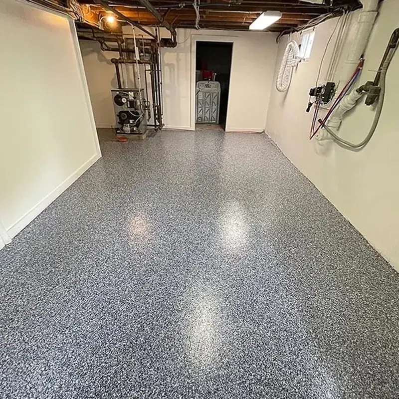 Basement utility room with a black, white and gray flake floor