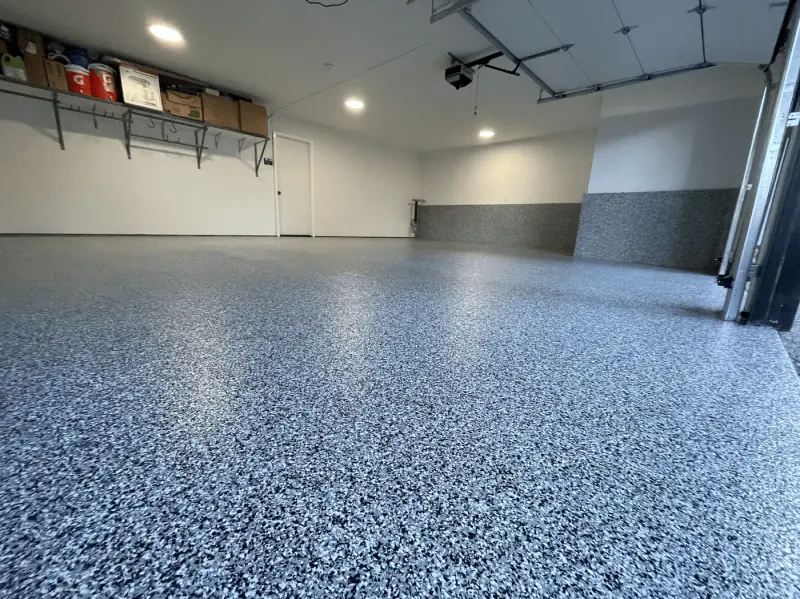 Low-angle view of a blue-gray flake garage floor