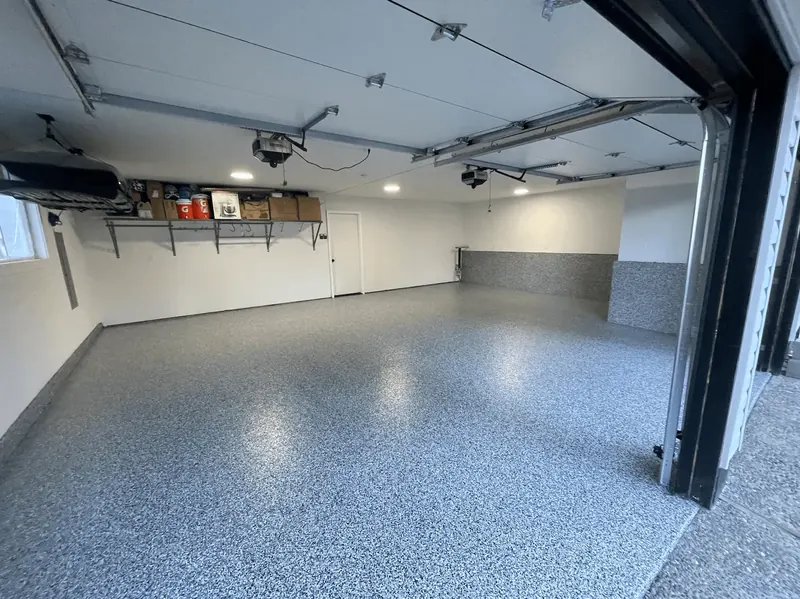 Blue granite flake floor under overhead storage racks in a Seattle-area garage
