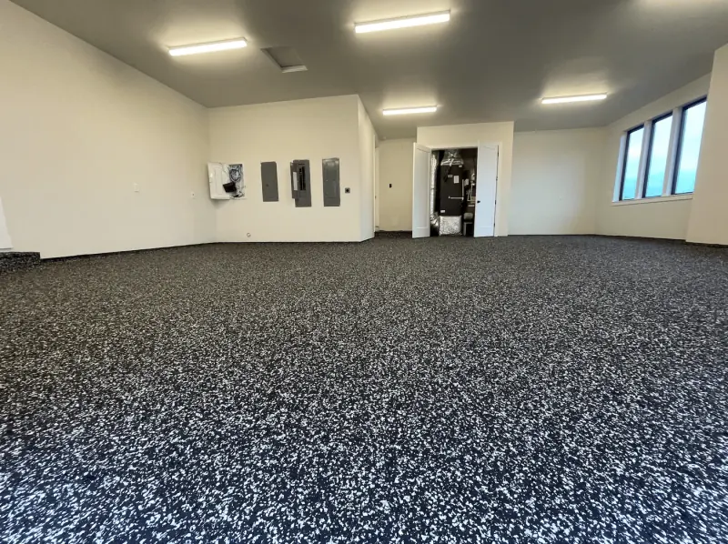 Seattle-area garage with a black and white domino flake floor