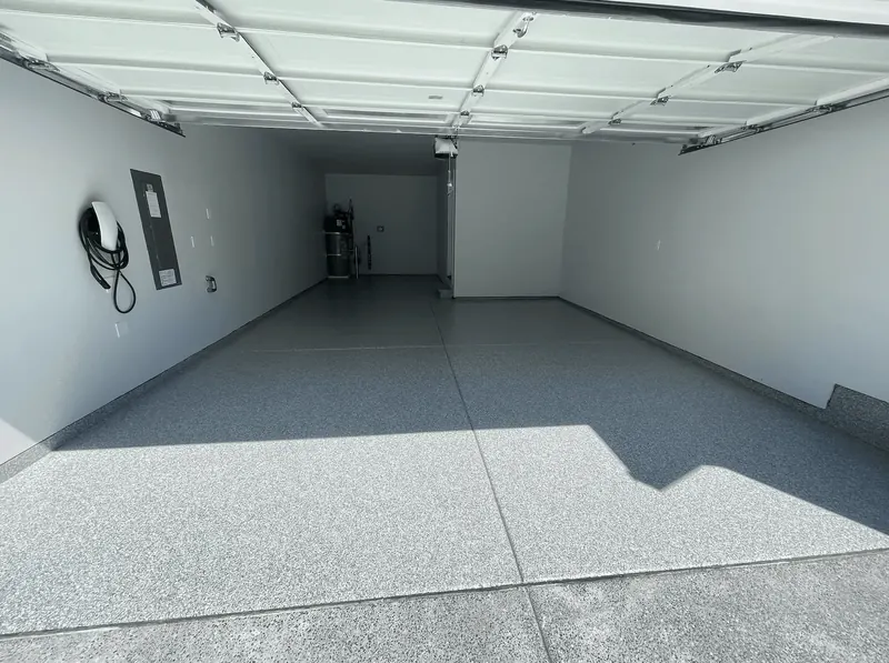 Platinum flake floor in a Seattle-area garage with a wall-mounted EV charger