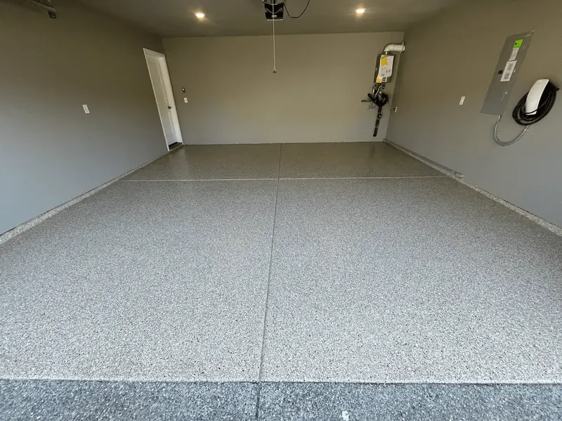 Garage with a stone gray flake floor coating