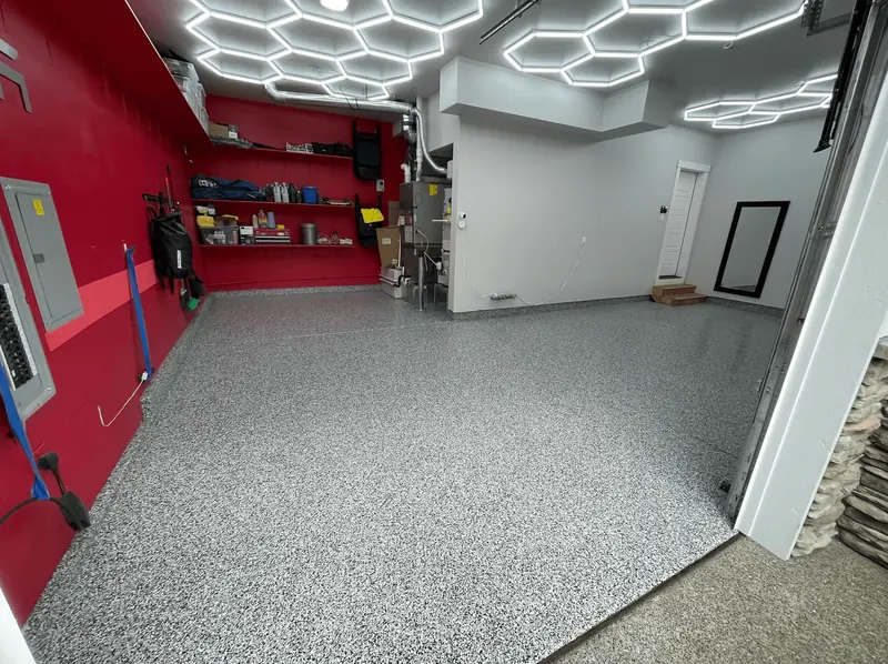 Storm gray flake floor under hexagon LED ceiling lights in a Seattle-area garage