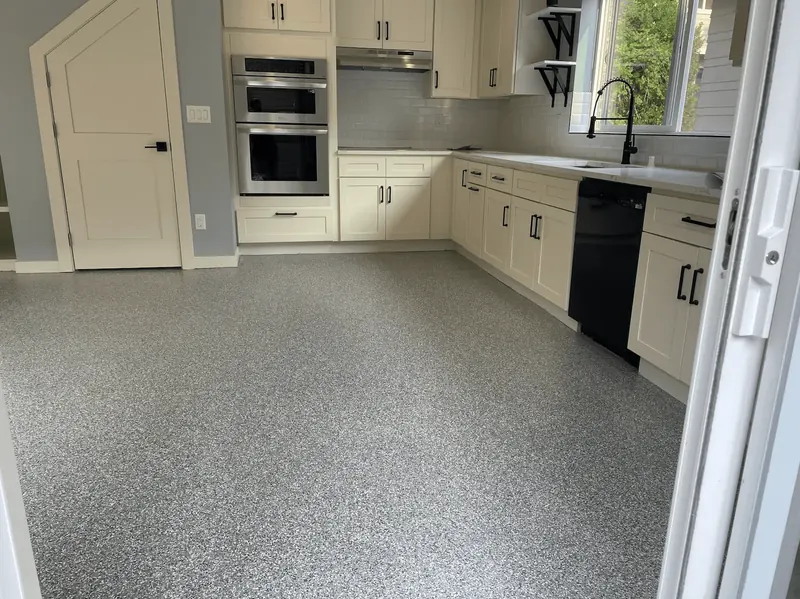 Residential kitchen with a gray flake floor coating