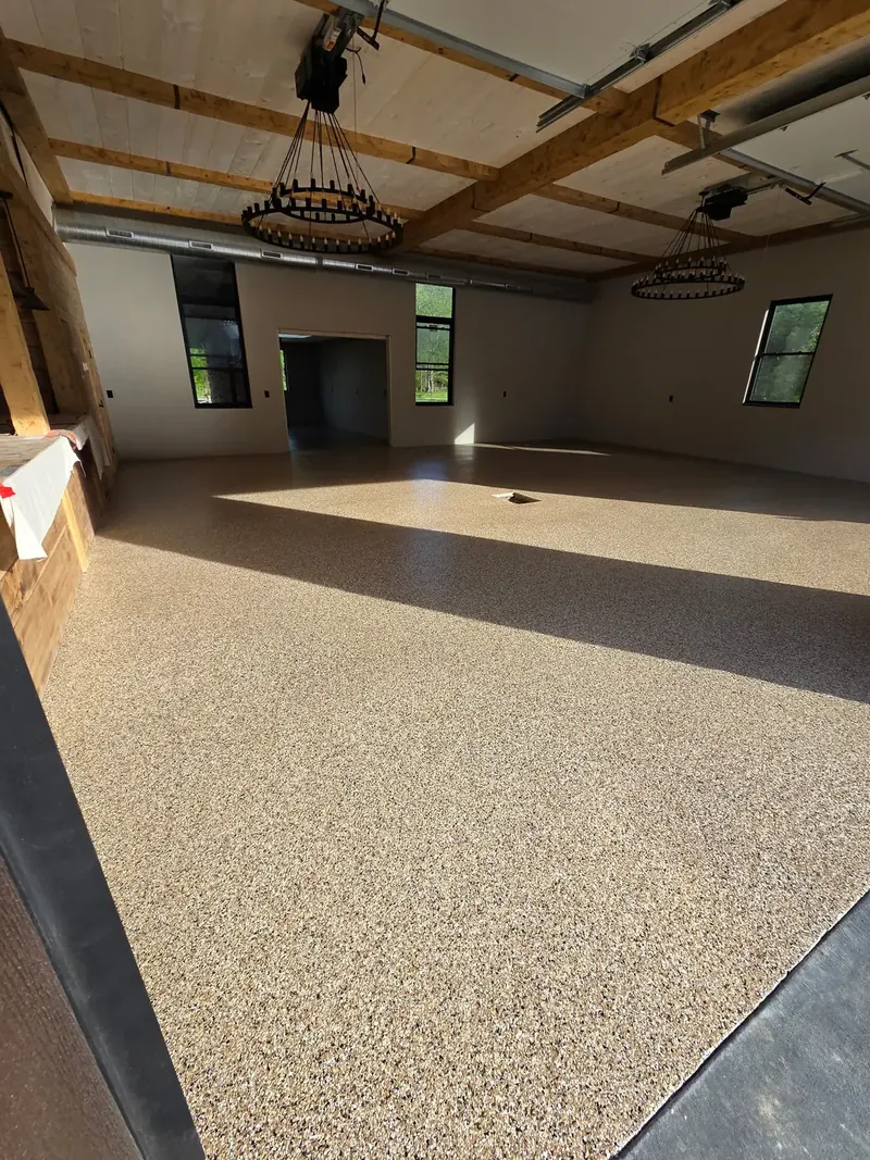 Finished residential great room with sandstone flake floor coating