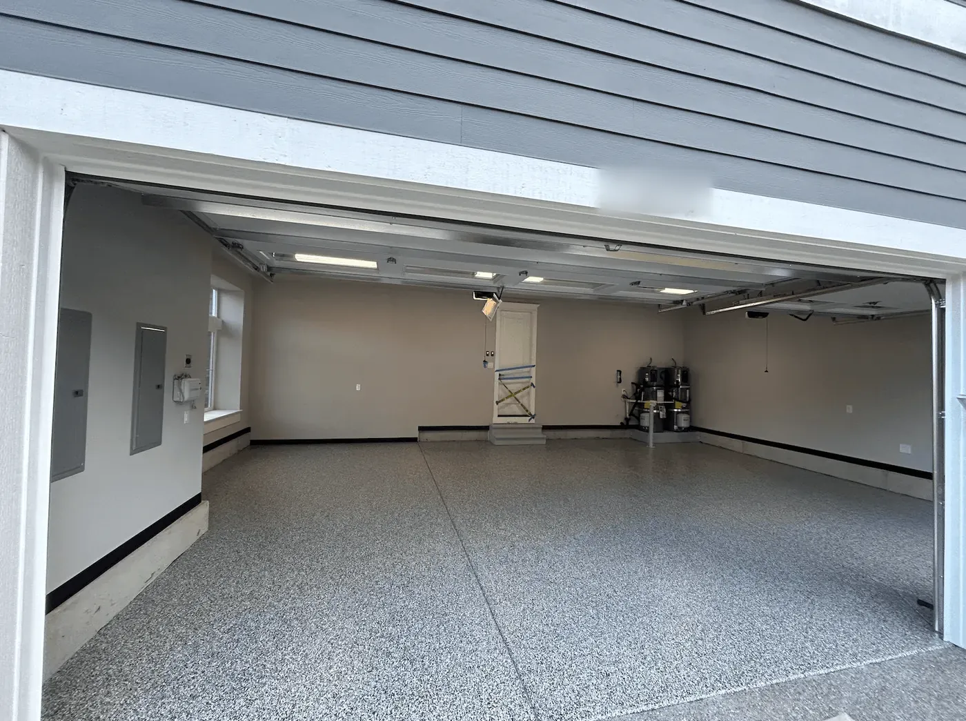 Seattle-area garage with a cloud gray flake floor coating